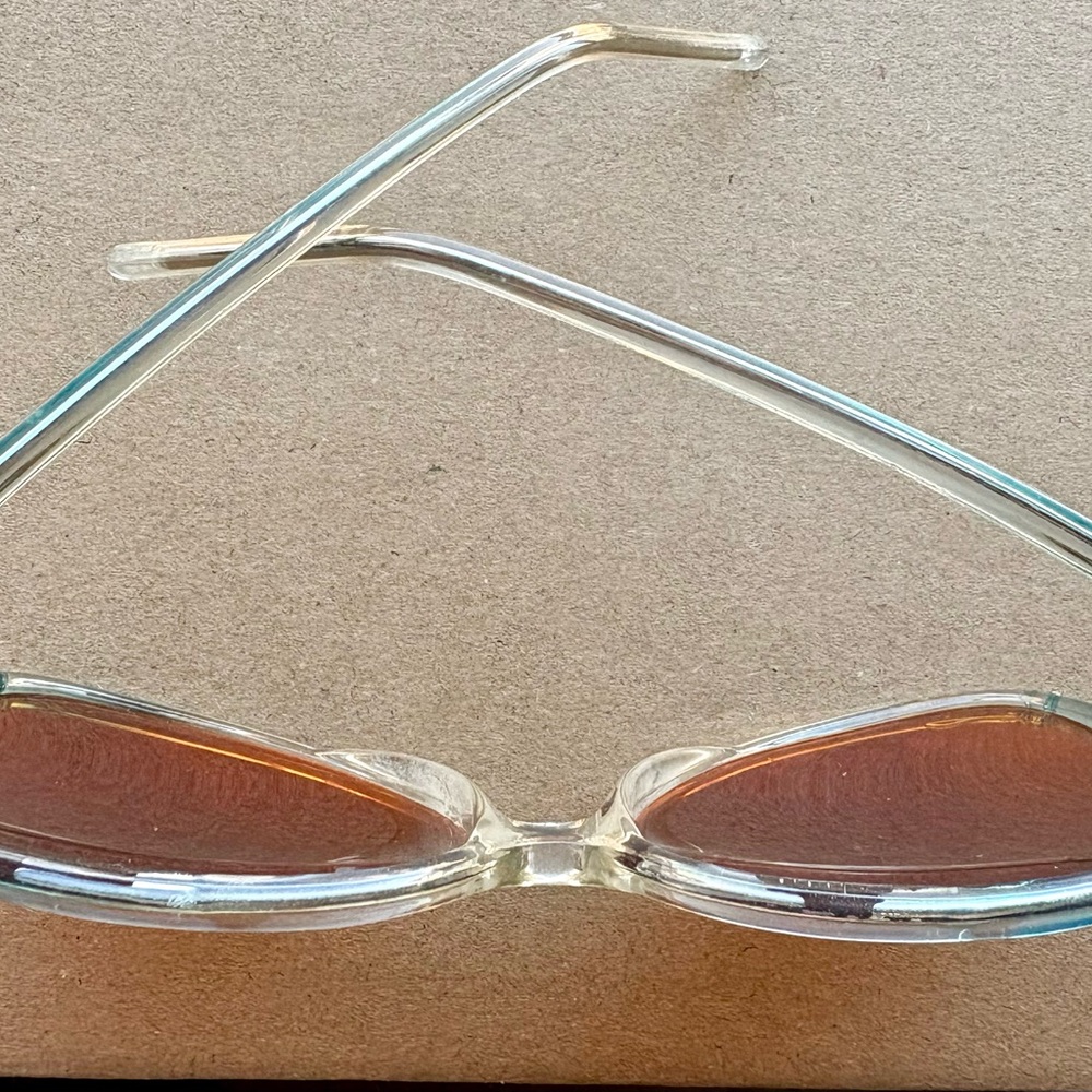Vintage turquoise frame and rose colored sunglasses.